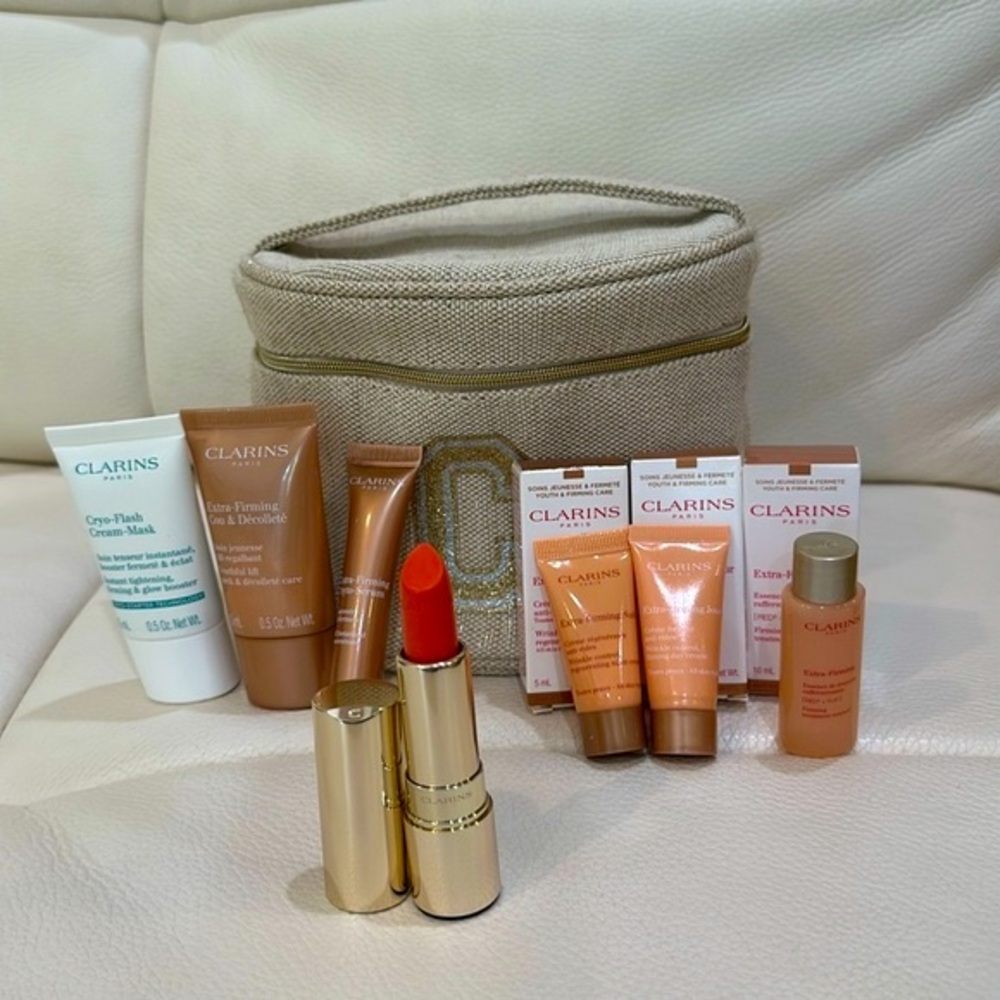 NWB Clarins 8 Piece Travel Set including Full Size Lipstick and Cosmetic Bag